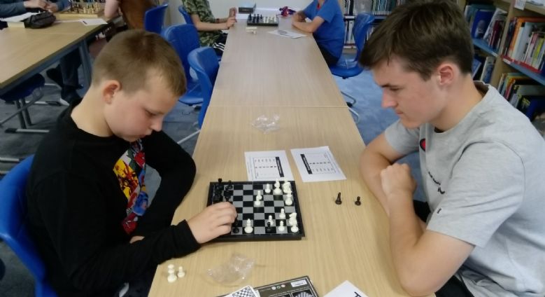 Two boys playing chess